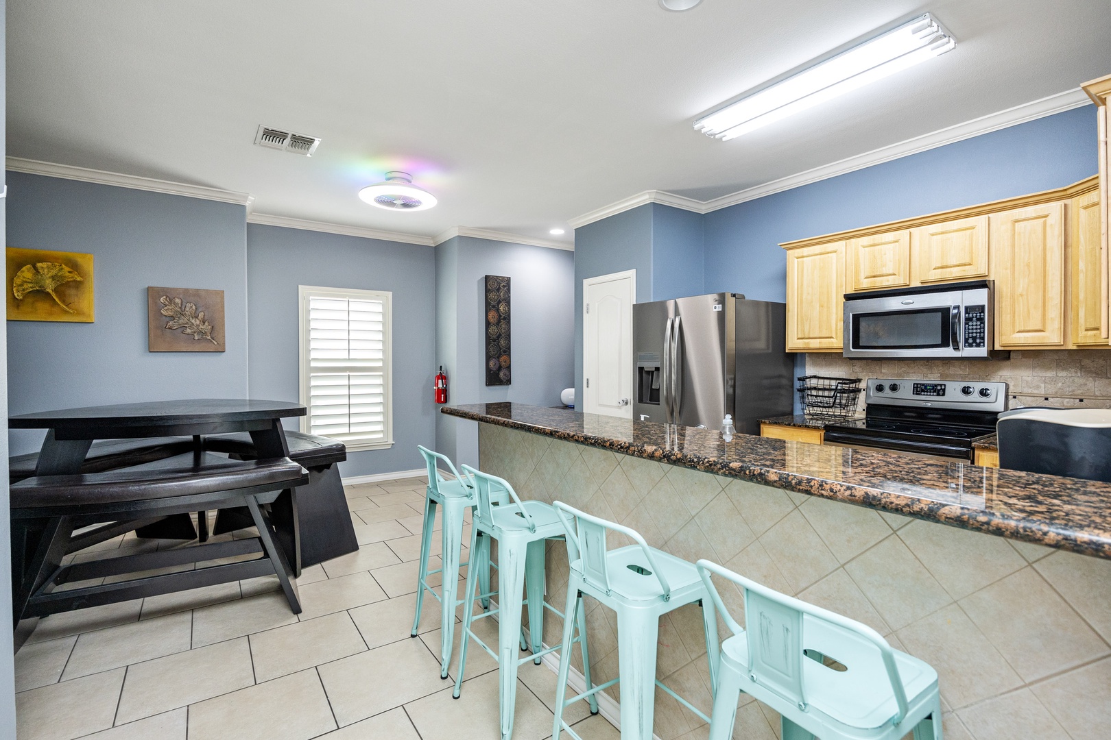 The open, airy kitchen offers ample space & all the comforts of home