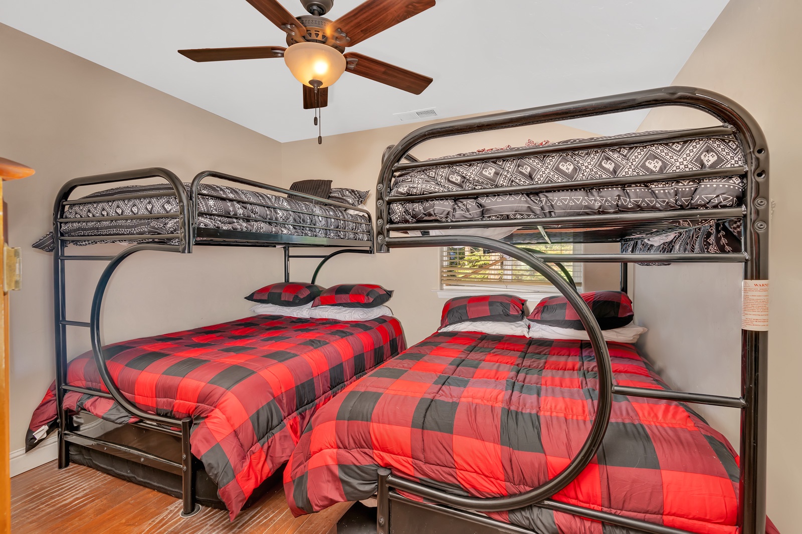 The final bedroom includes a pair of twin-over-full bunkbeds & Smart TV