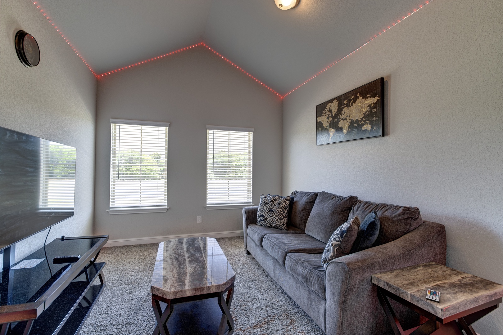 Bonus room with comfy sofa and Smart TV