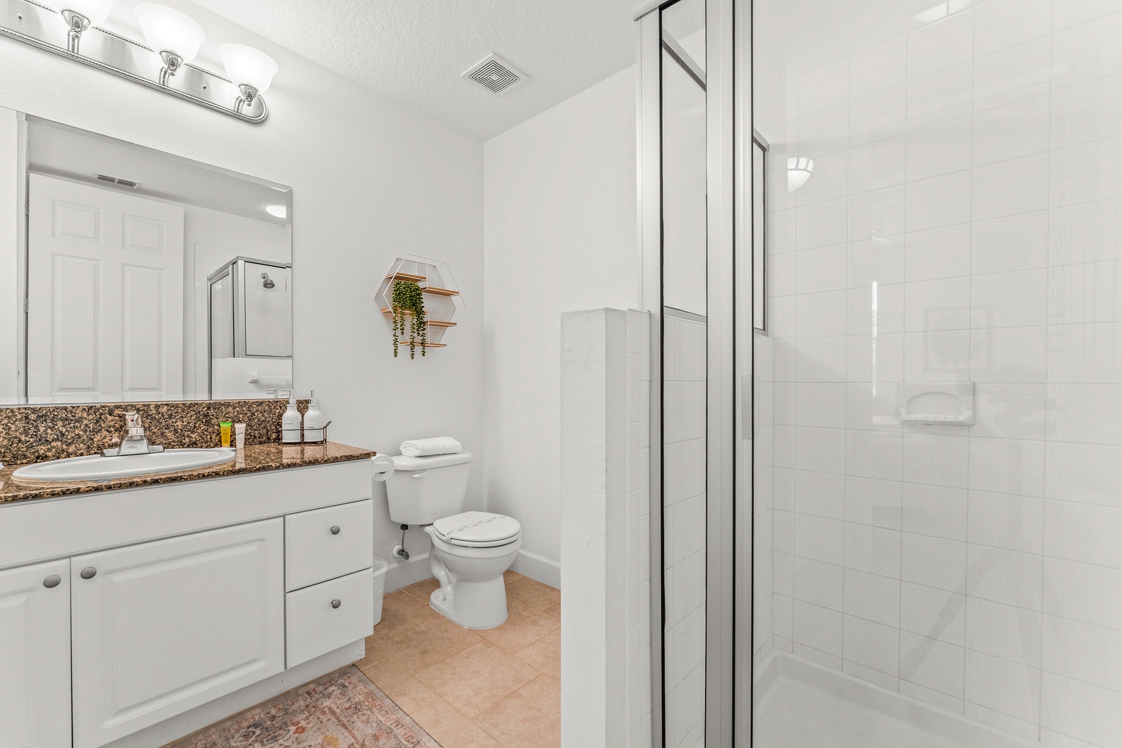 Modern shared bath with single vanity & spacious stand-alone shower