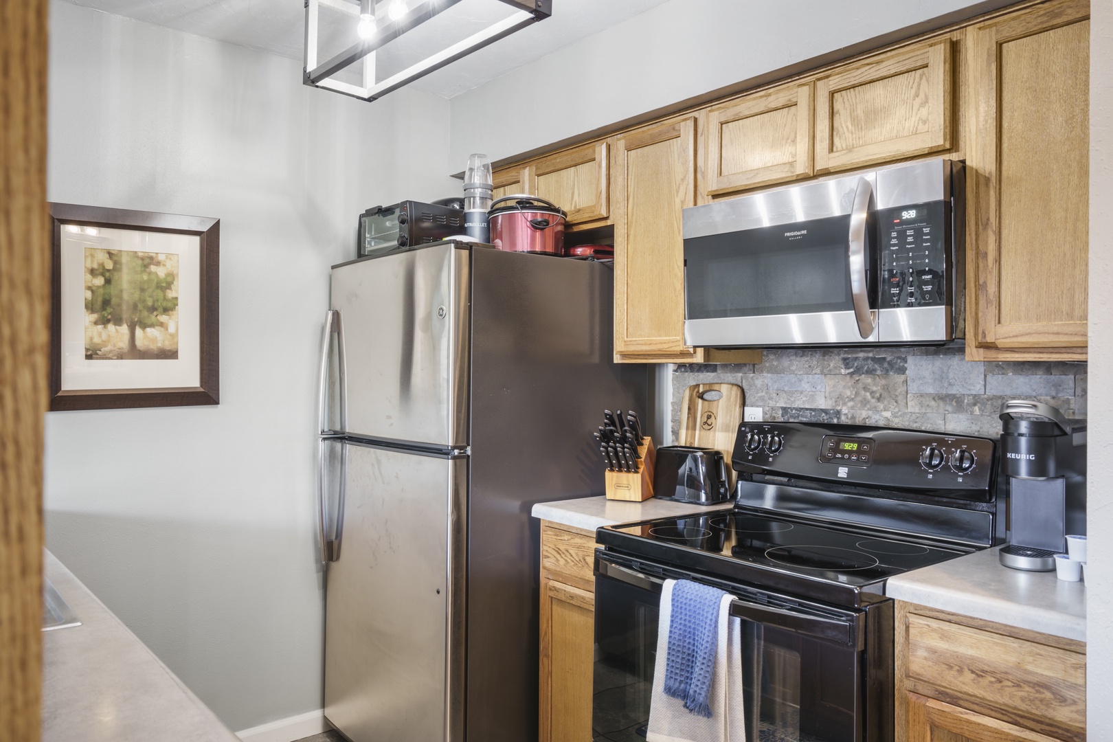 The open, airy kitchen offers ample space & every home comfort