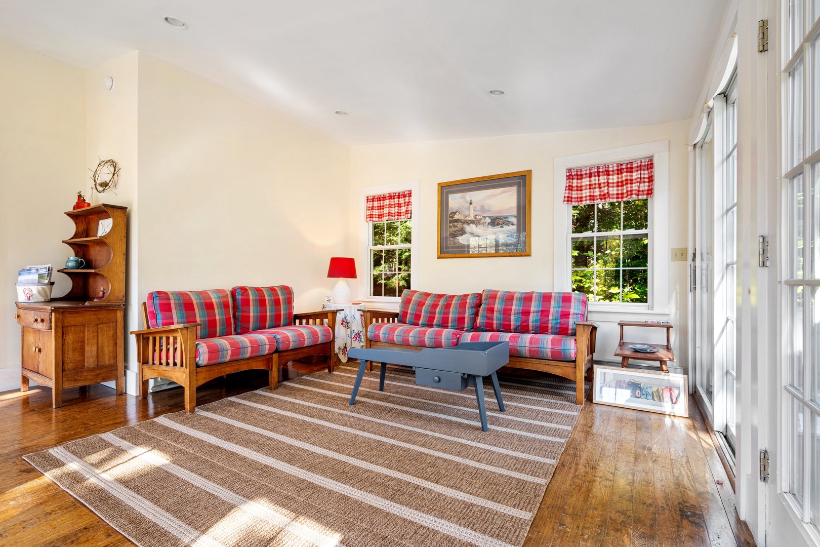 Bright living area with ample seating and Smart TV