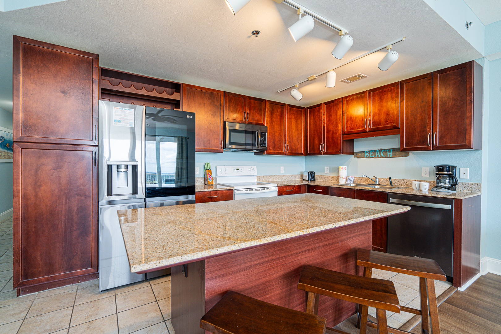 The open, airy kitchen offers ample space & all the comforts of home