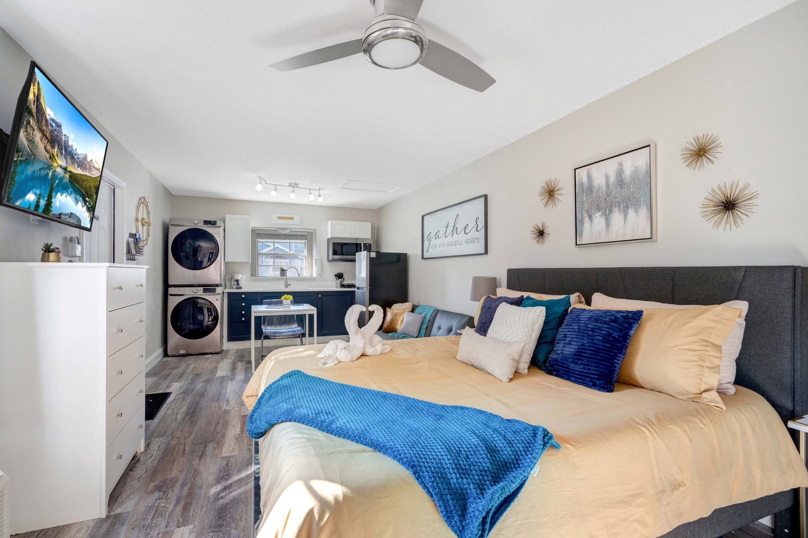 Relax in this cozy studio with a king bed, smart TV, and ceiling fan