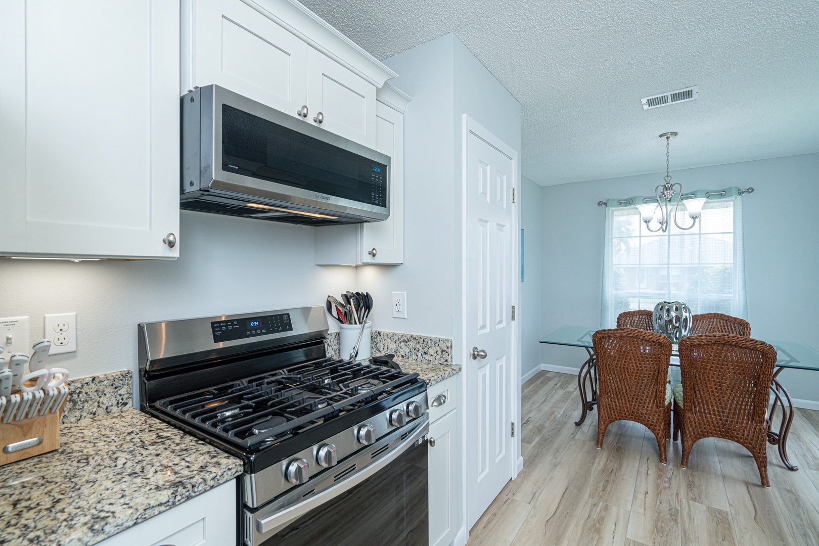 The breezy kitchen offers ample space & all the comforts of home