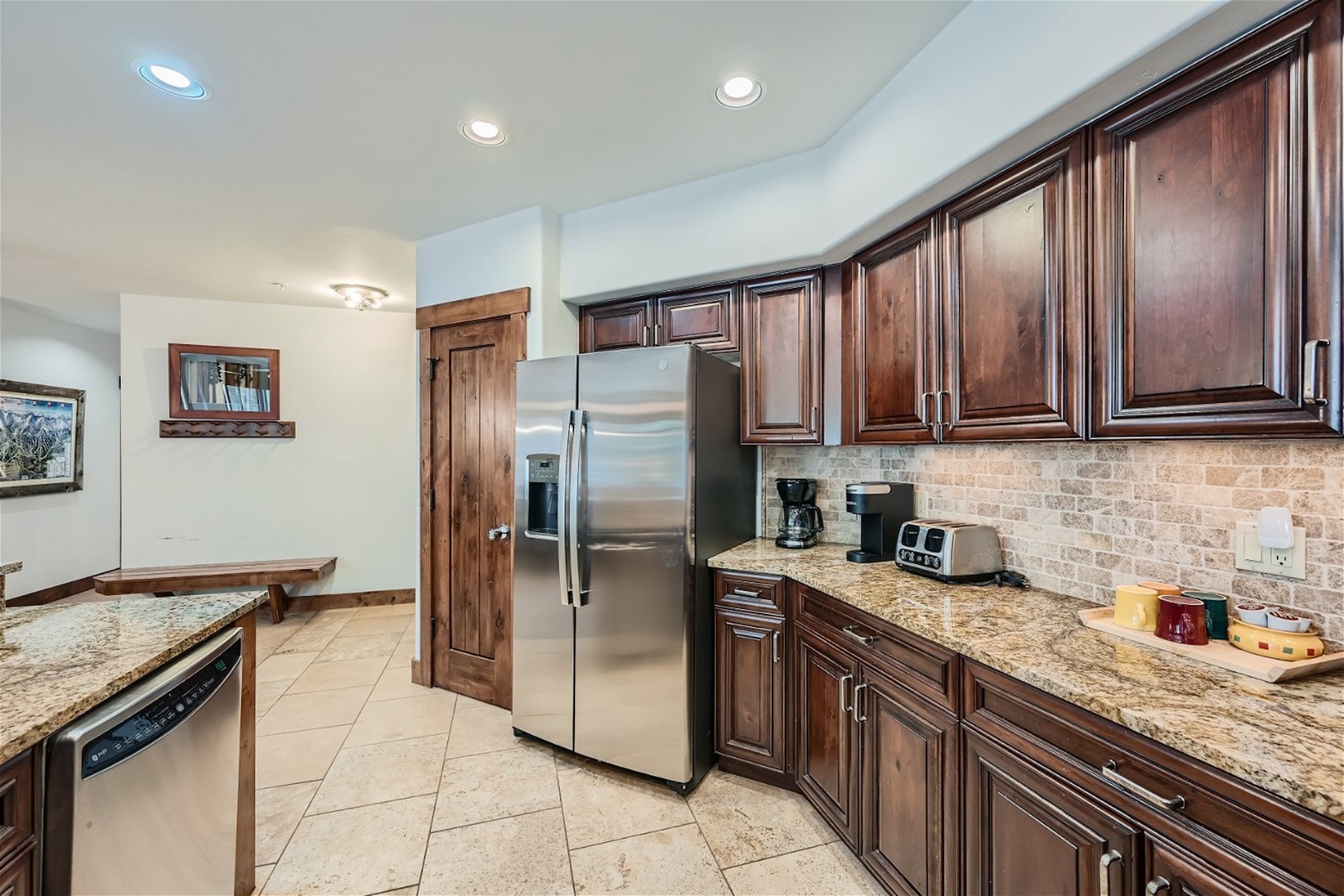 The open, elegant kitchen offers ample space & all the comforts of home