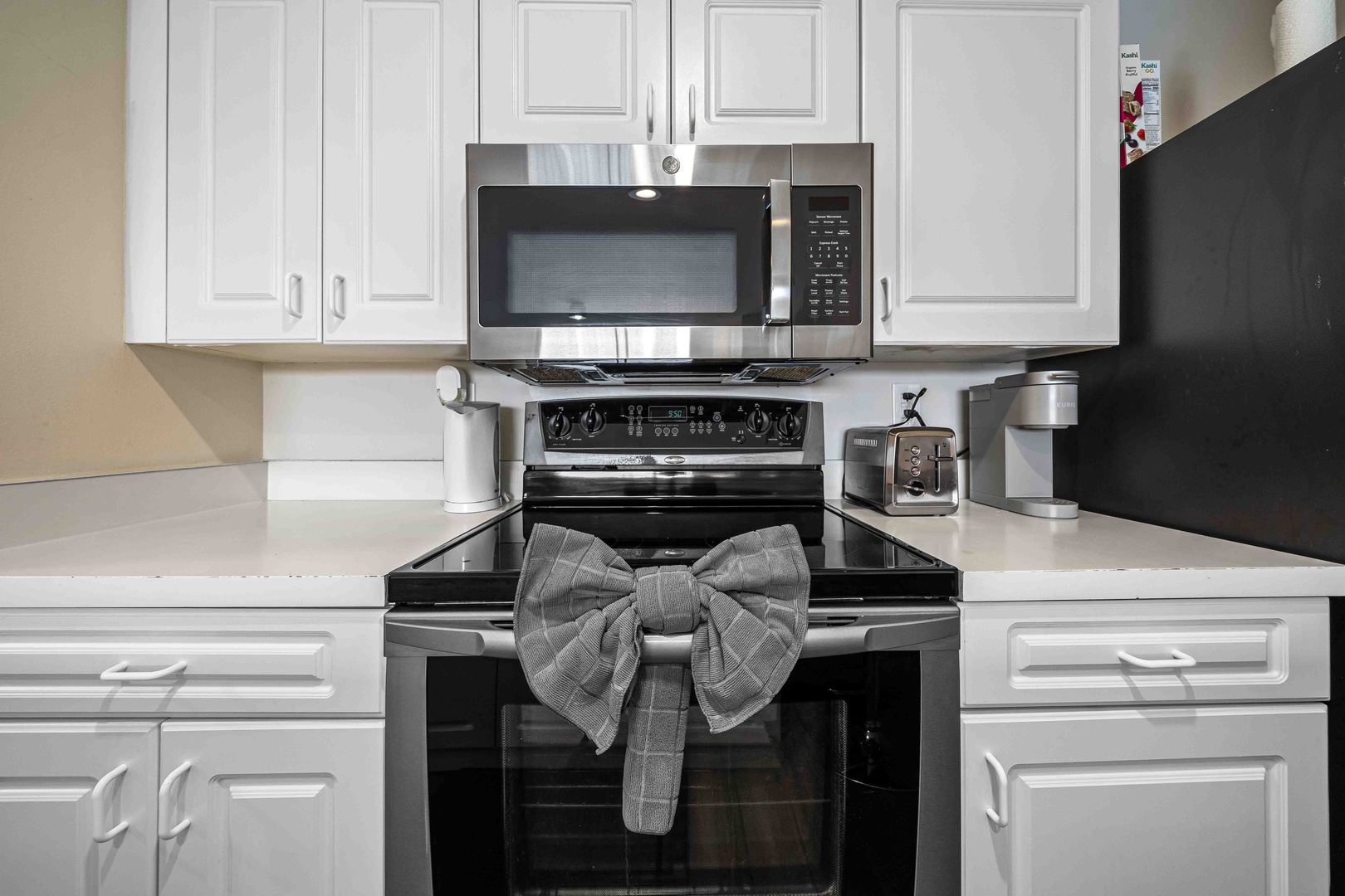 The cozy kitchen offers ample space & all the comforts of home