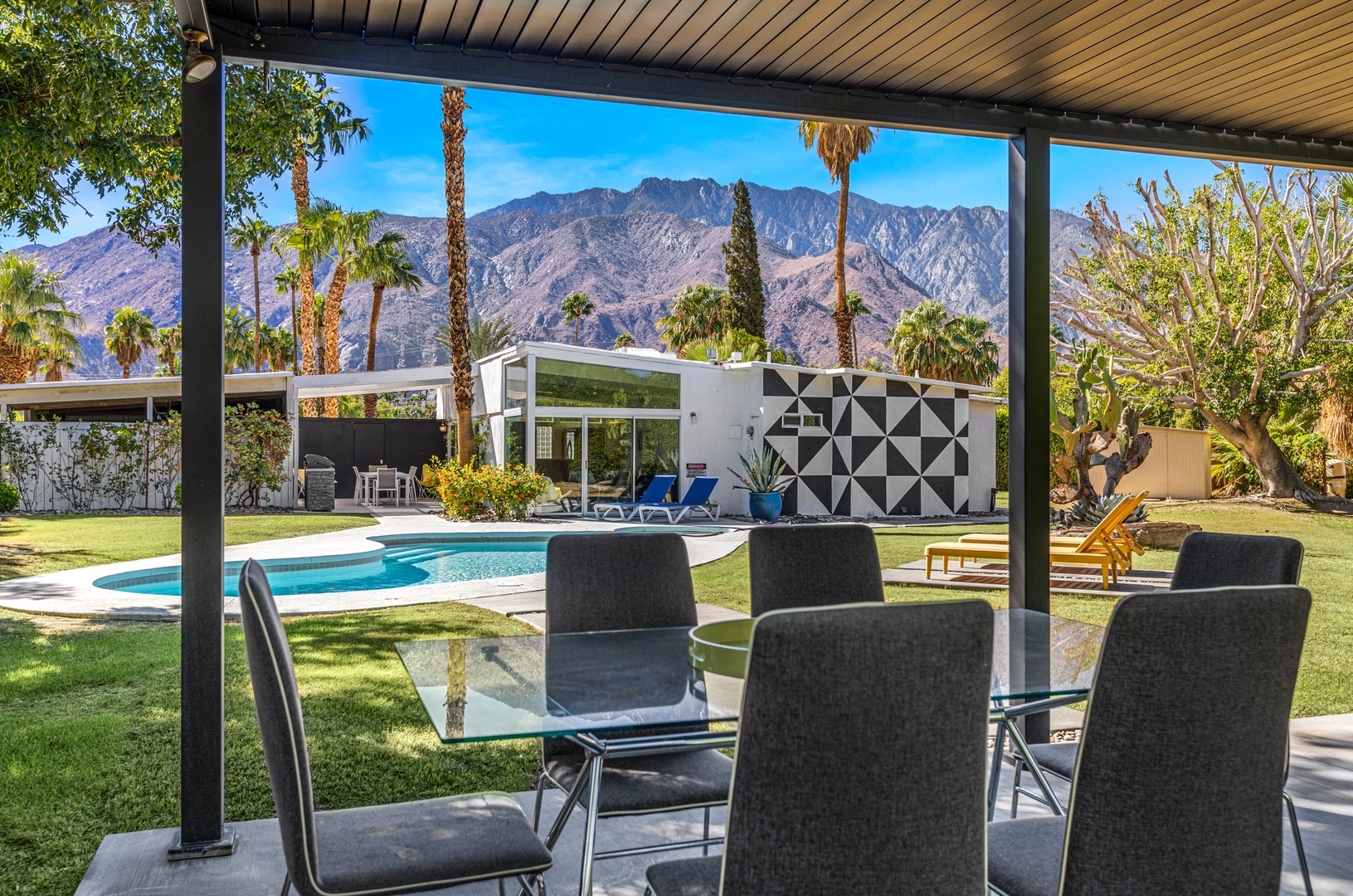 Gazebo with outdoor dining by the pool