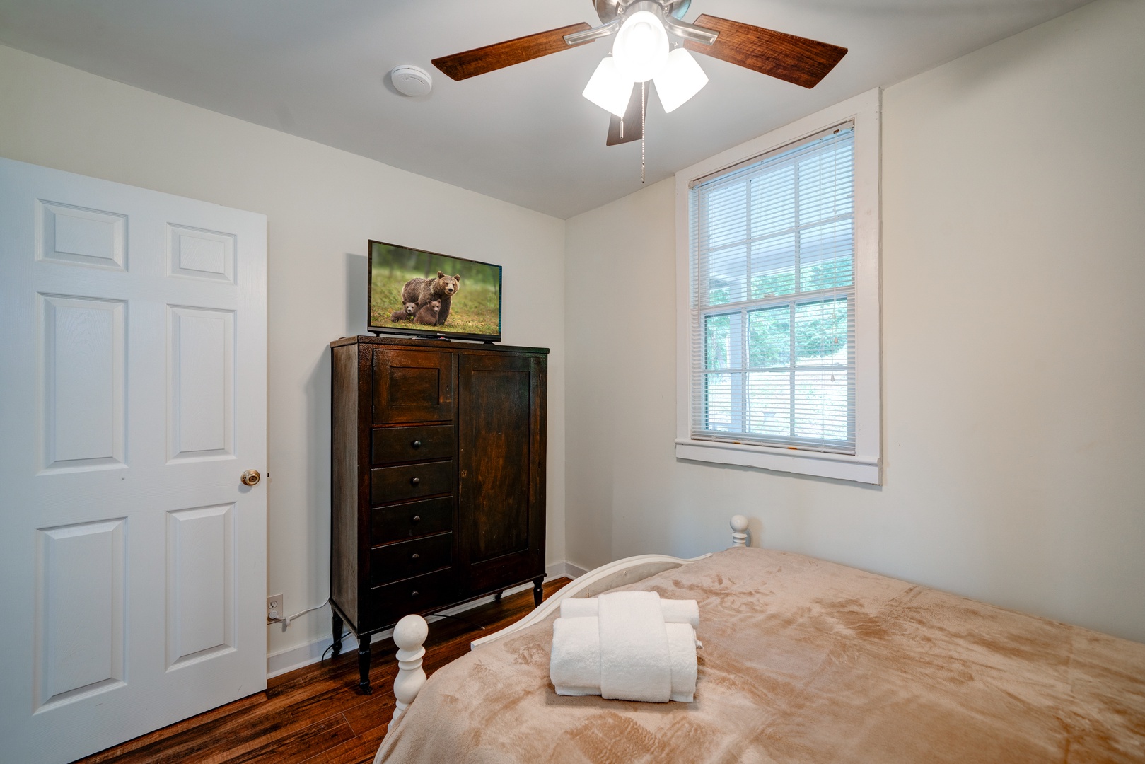 The second bedroom sanctuary offers a queen-sized bed & Smart TV