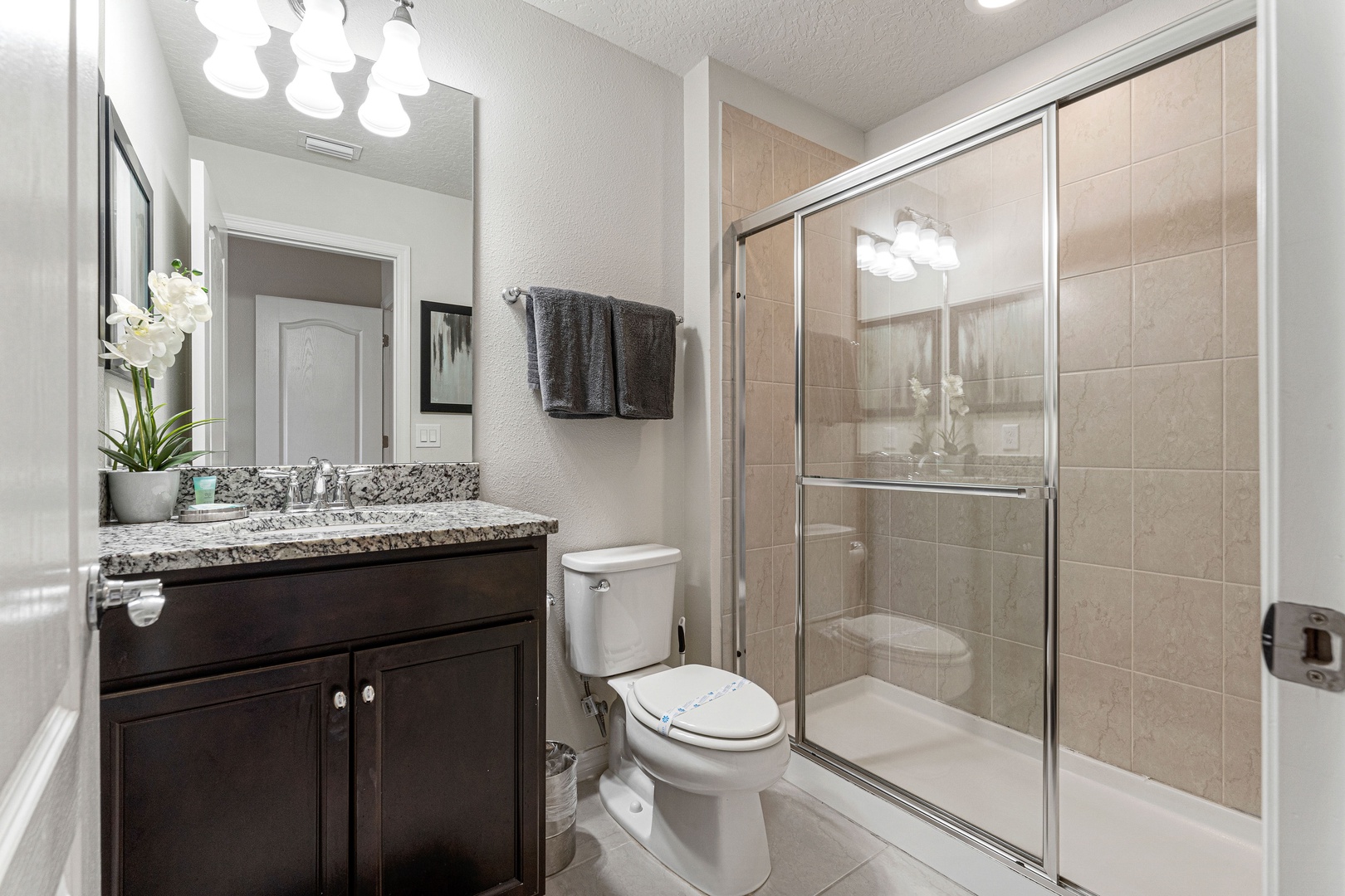 Bedroom ensuite with single vanity and walk-in shower