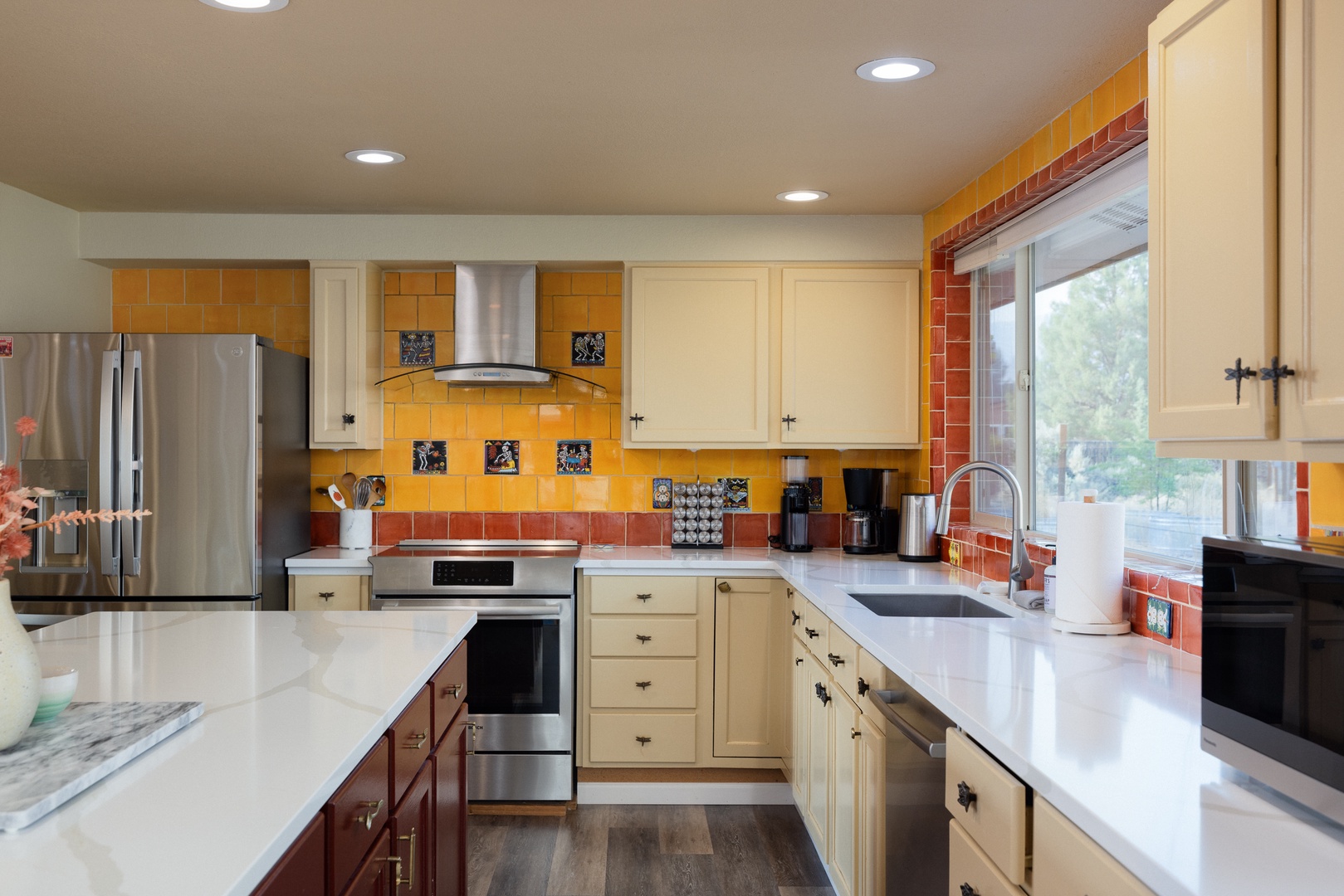 The warm, inviting kitchen offers ample space & every home comfort