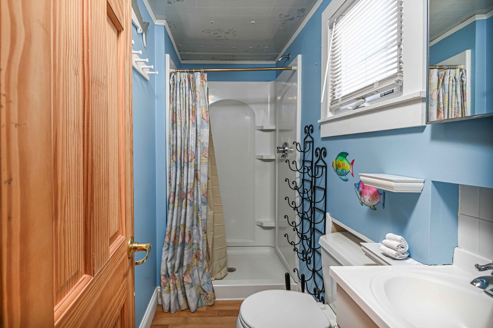 The full bathroom includes a single vanity & walk-in shower