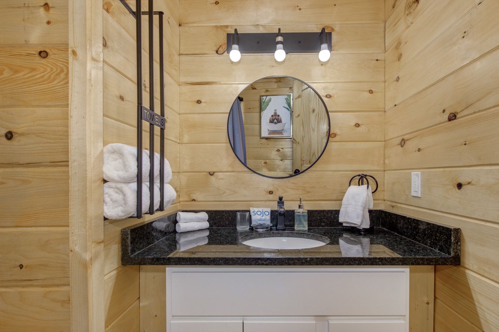 The additional full bathroom includes a single vanity & shower/tub combo