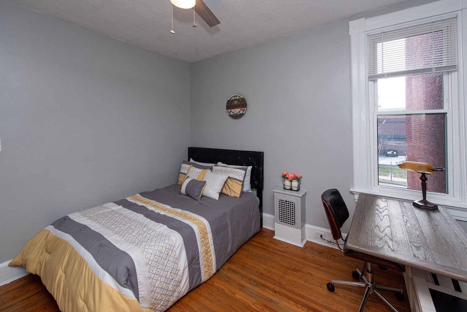 The 2nd of 3 bedrooms offers a full bed, Smart TV, & desk/workspace