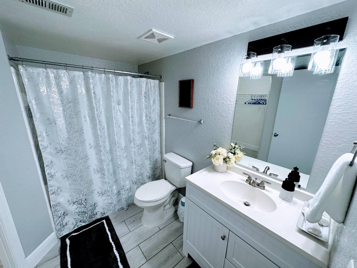 Wash up in this queen ensuite, with a single vanity with shower/tub combo