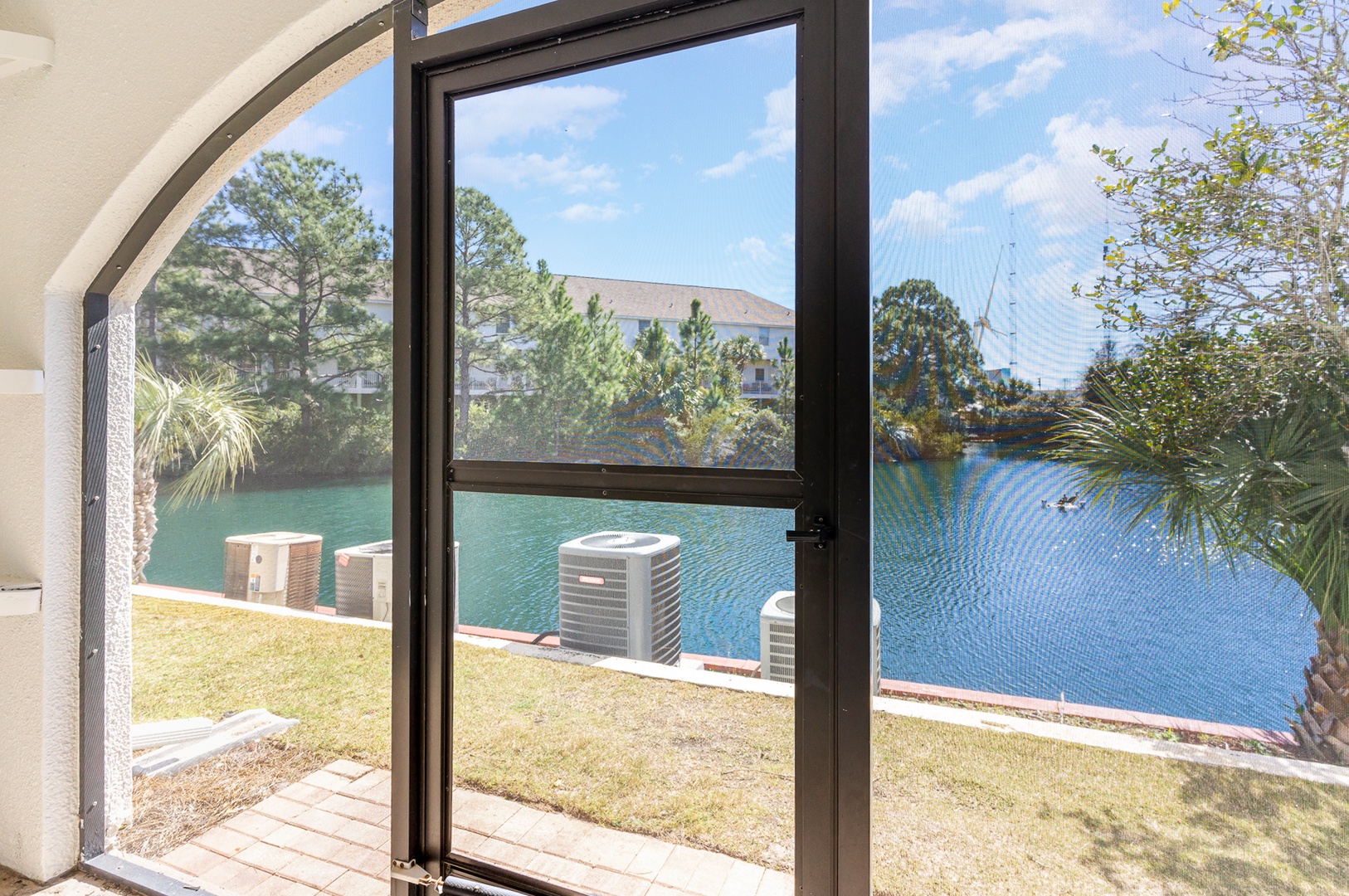 Lounge the day away with serene water views on the screened patio