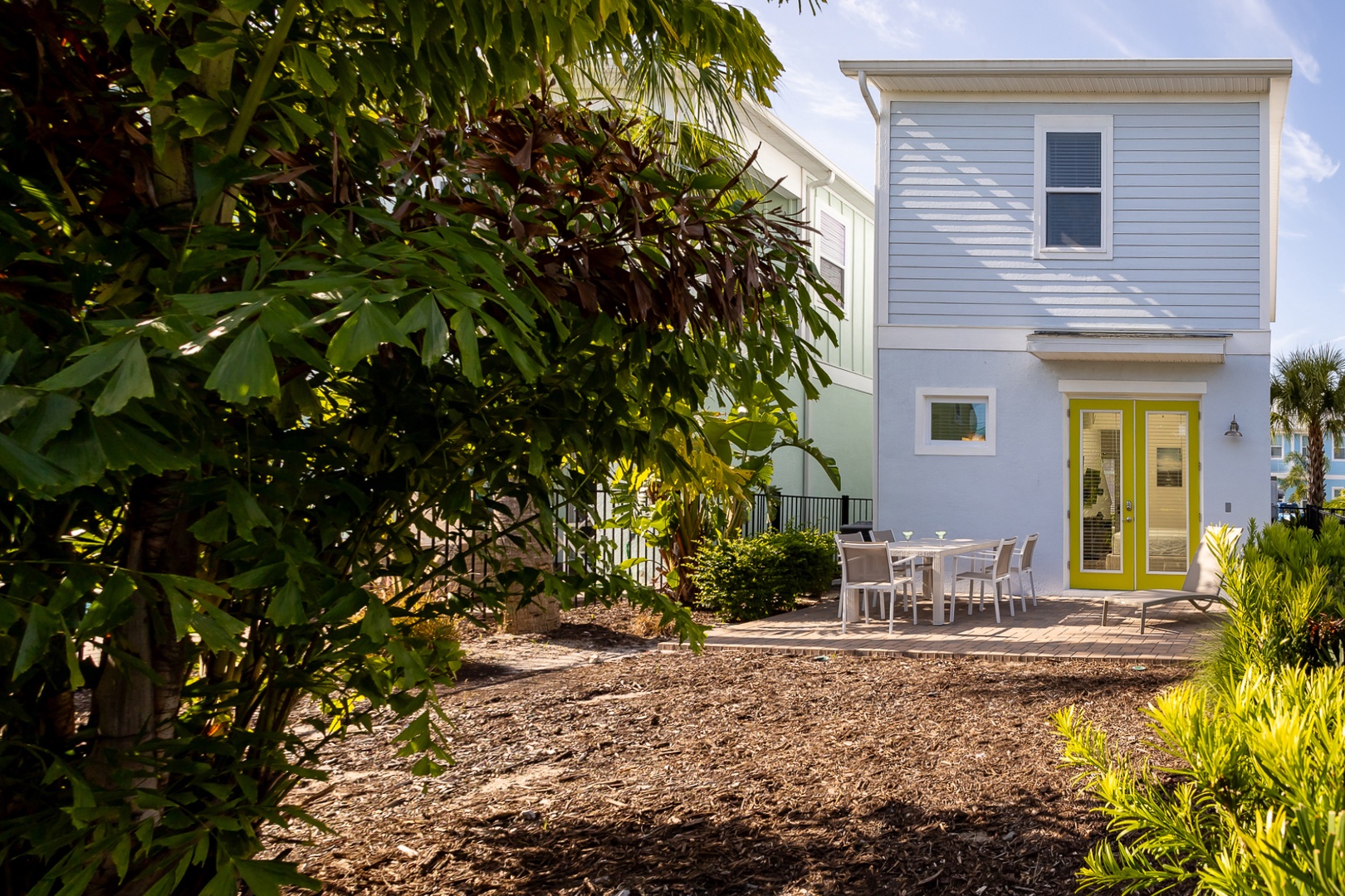 The sunny, fenced back yard offers ample space for relaxation & play