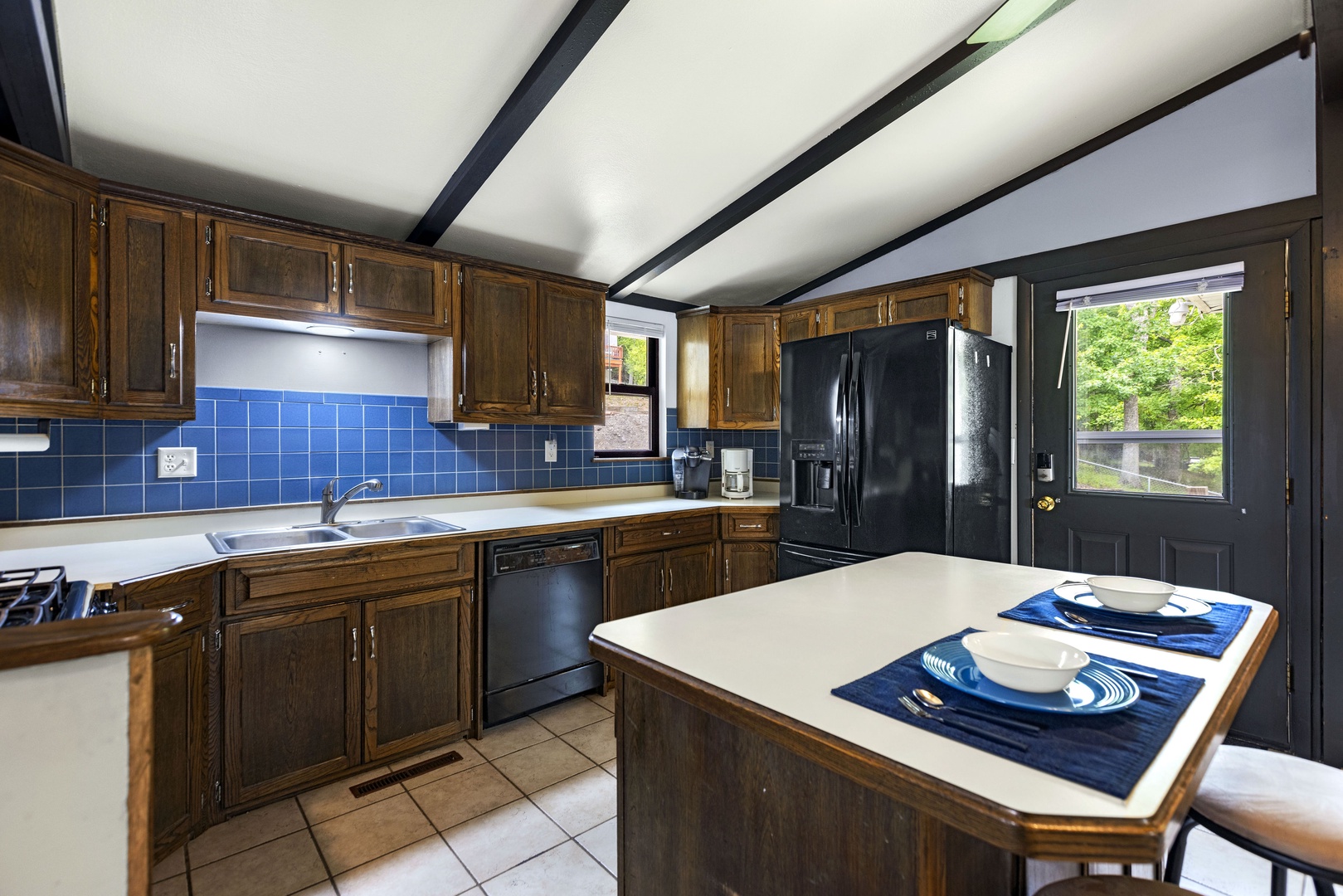 The open kitchen offers ample space & all the comforts of home