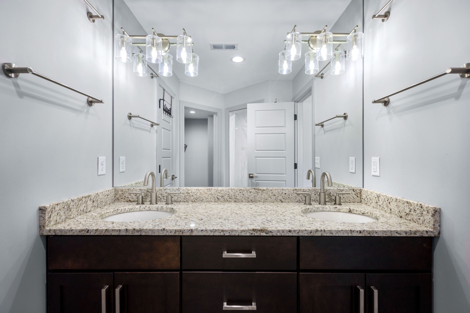 The private king ensuite offers a double vanity sink & walk-in shower