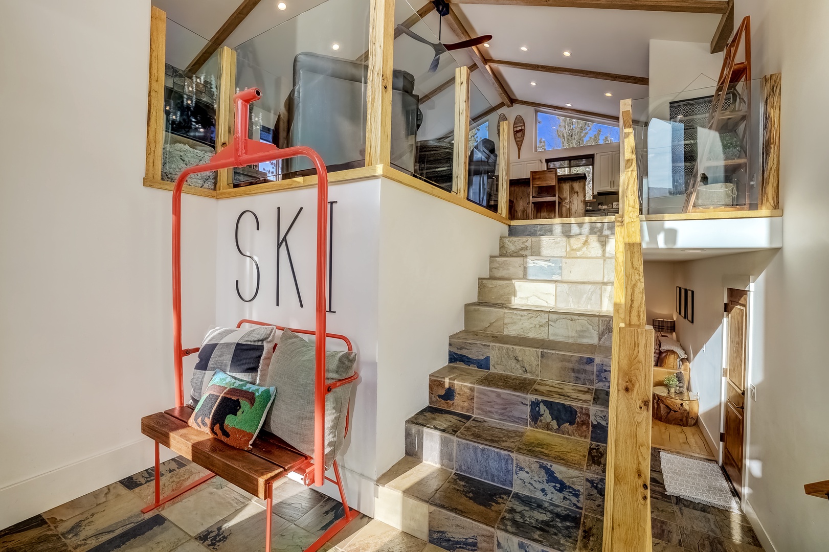 Split level landing and front entry with cool ski lift chair