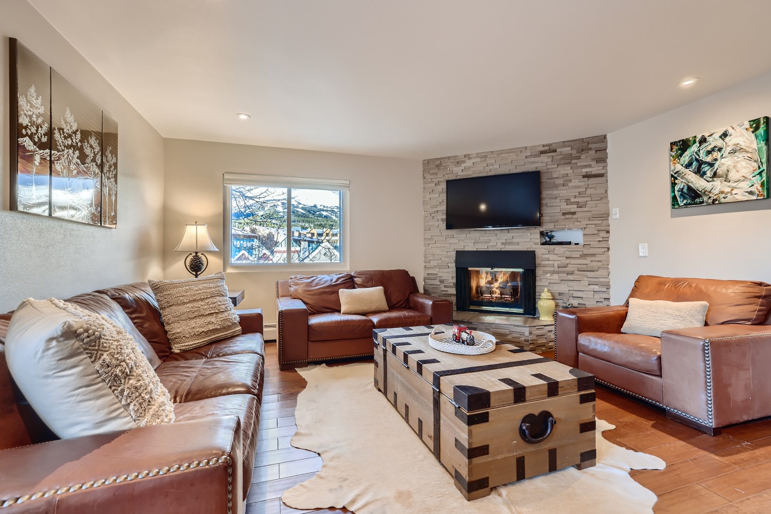 Open living space with fire place, and TV