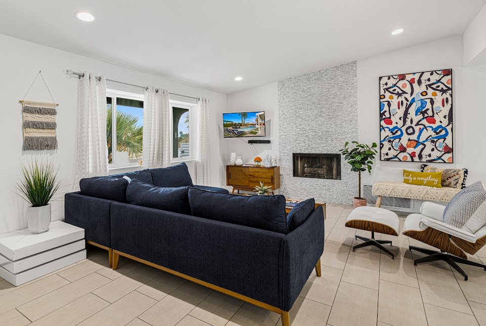 Modern spacious living area with TV