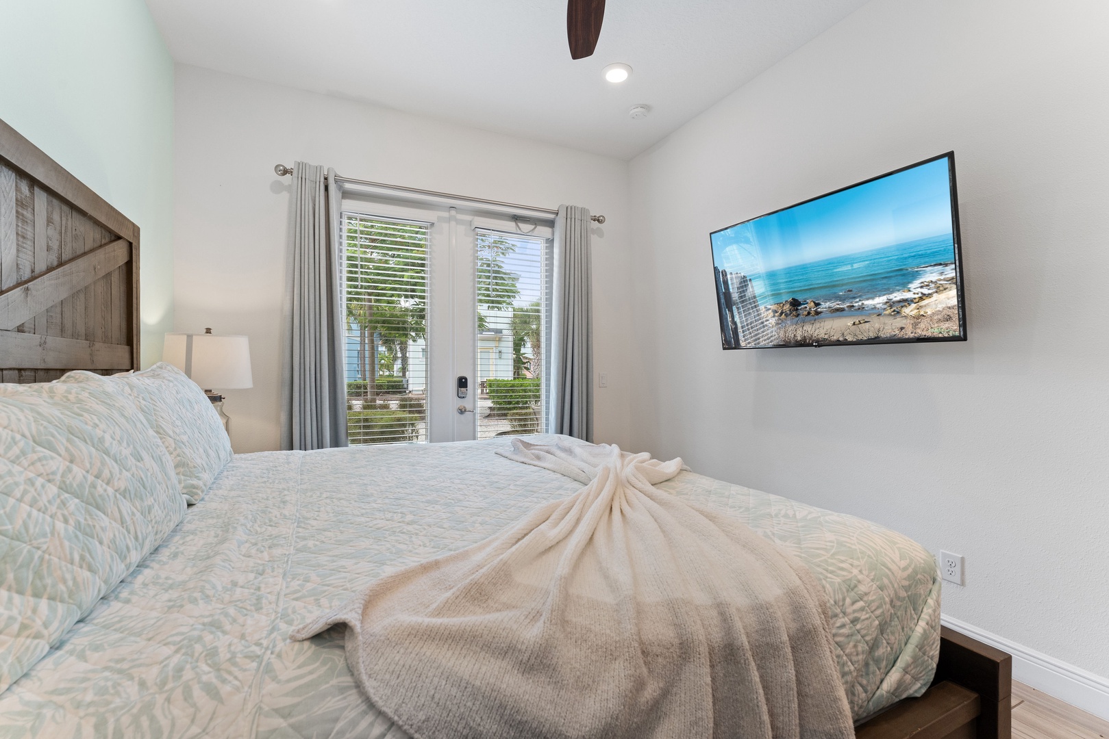 This spacious king suite boasts a private ensuite, smart TV, & patio access