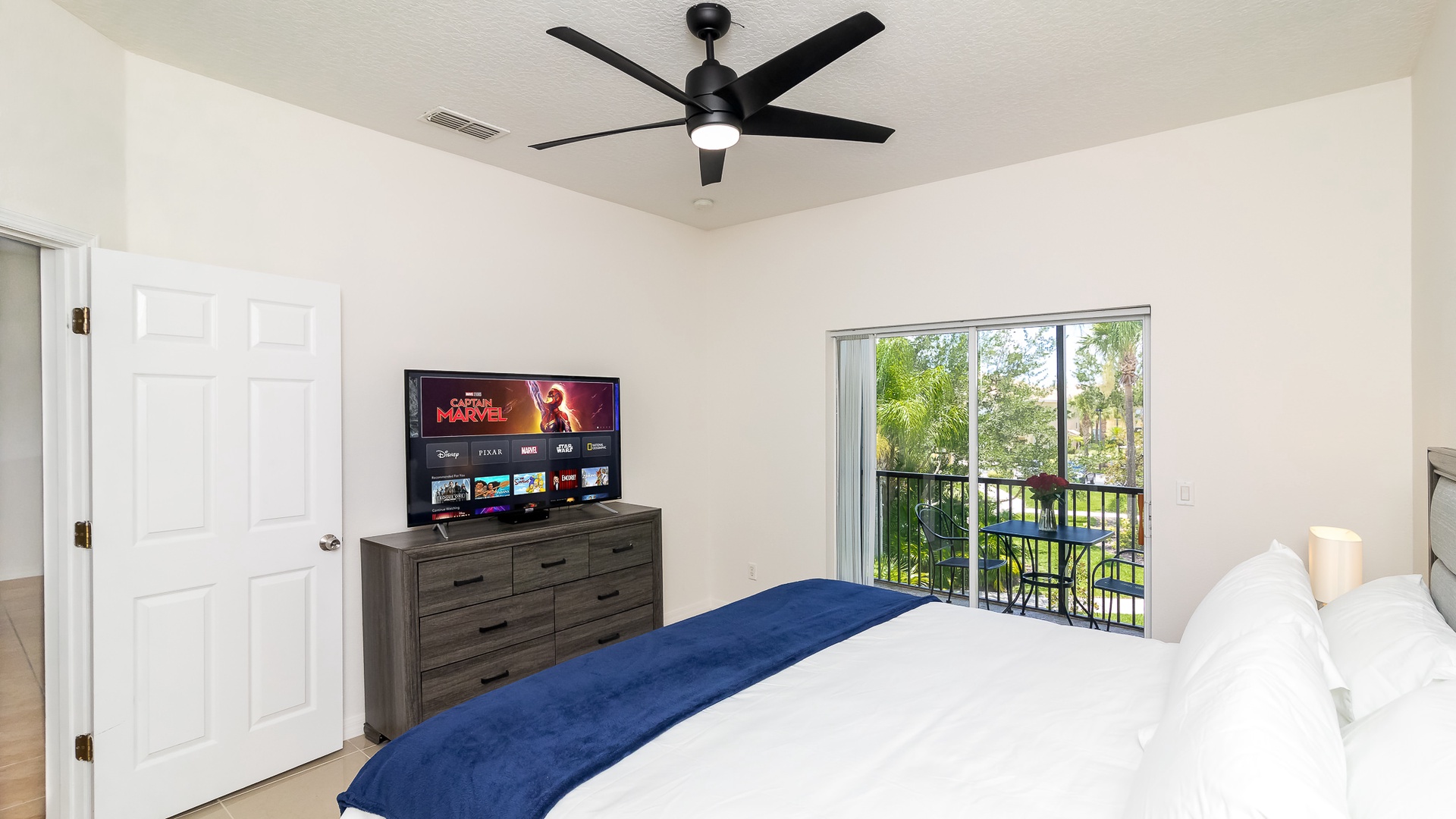 Bedroom 1 master with King bed, TV, balcony, access, and en-suite