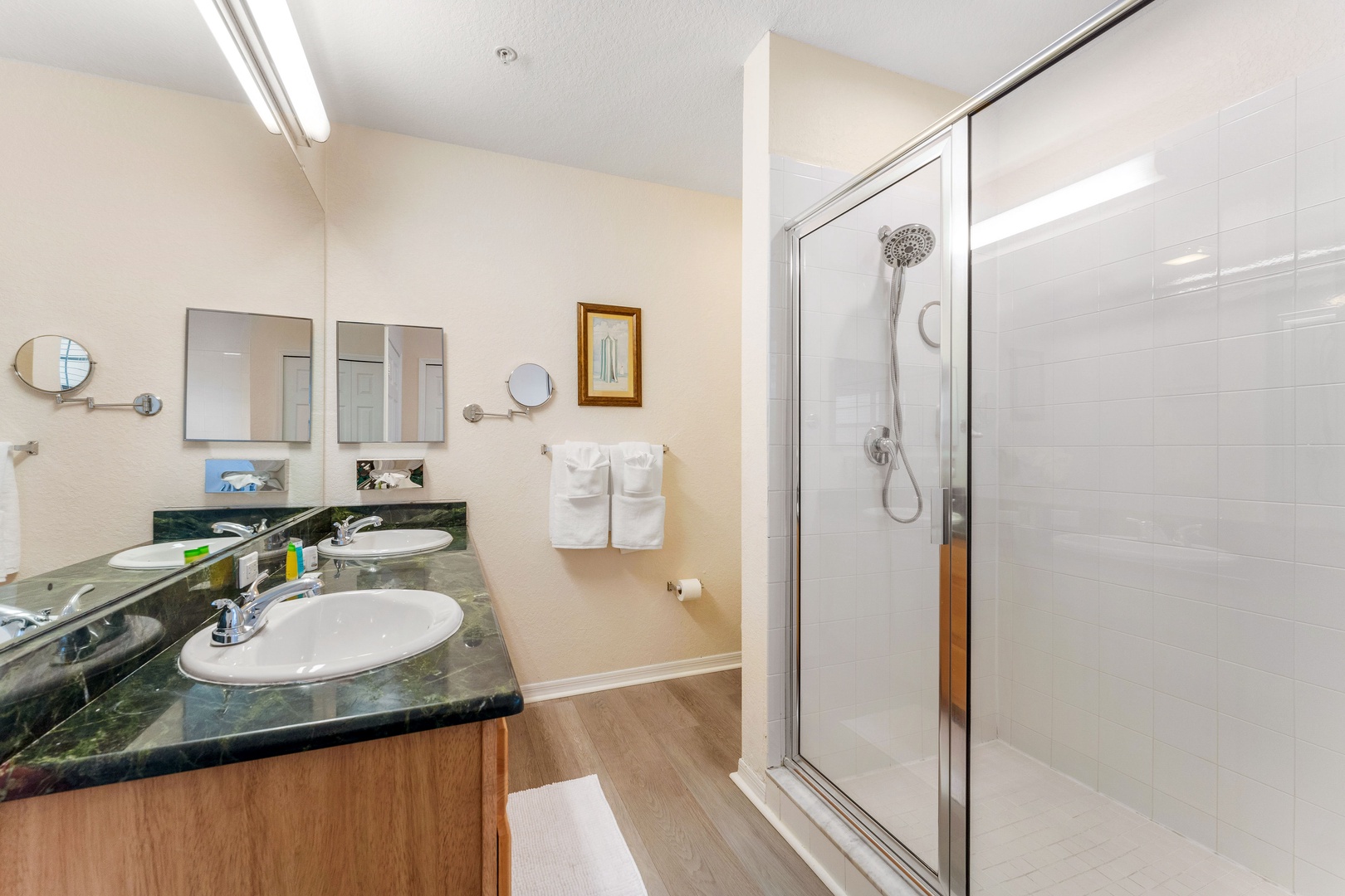 Wash up in this ensuite, featuring a single vanity with walk-in shower