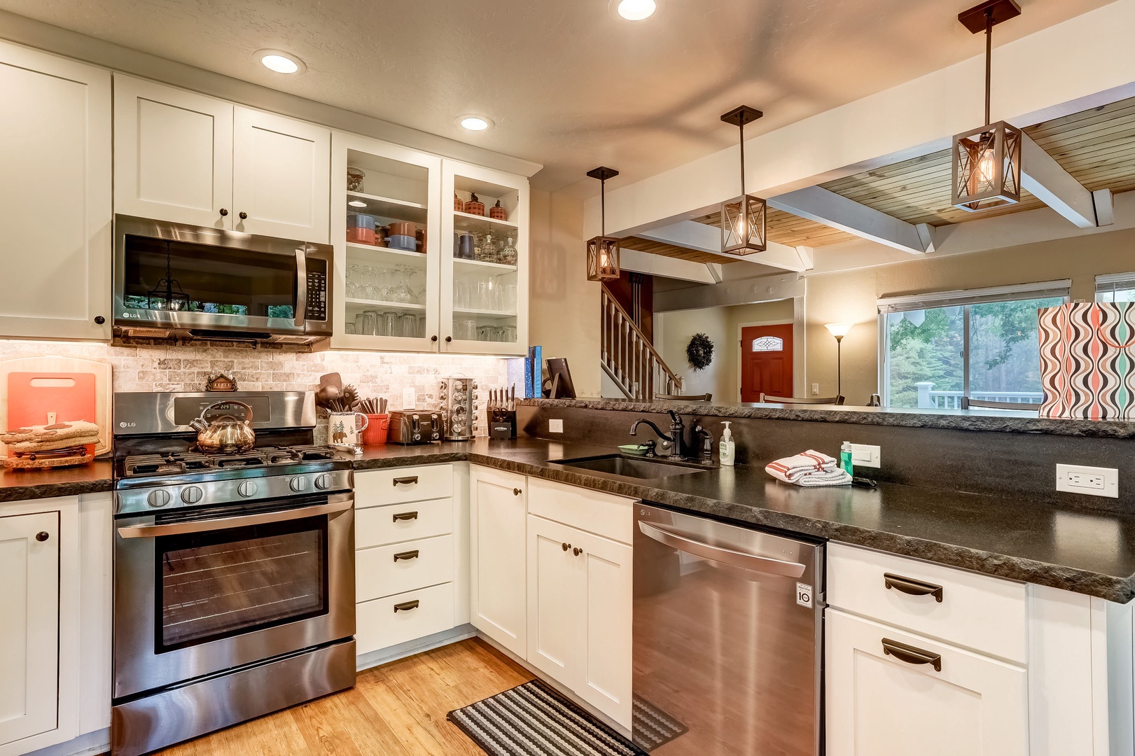 Full kitchen with stainless steel appliances, toaster and more