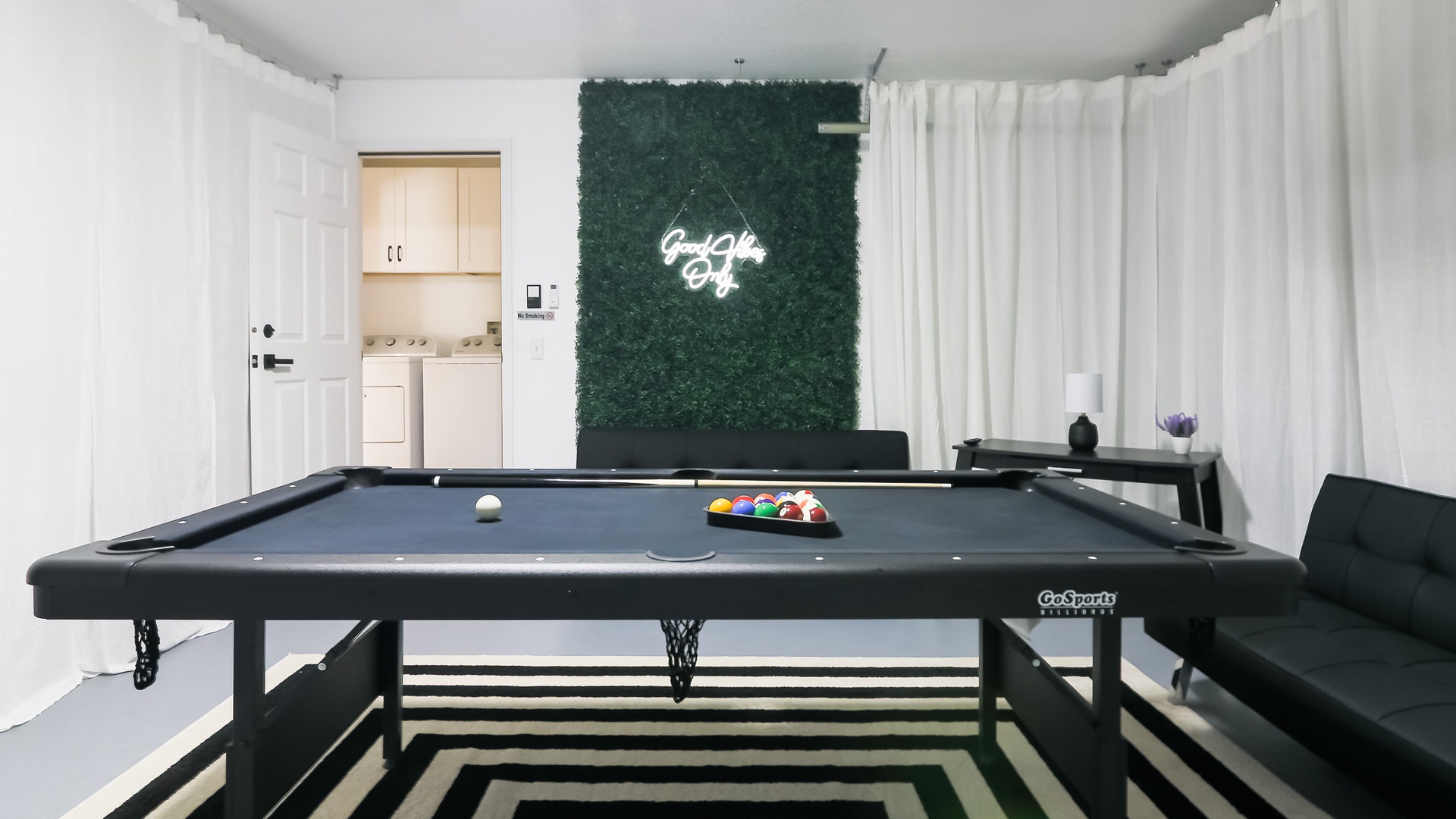 Air conditioned garage transformed into game room