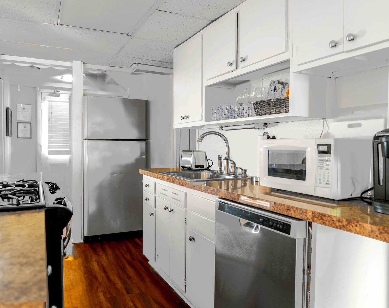 The cozy kitchen offers ample storage space & all the comforts of home