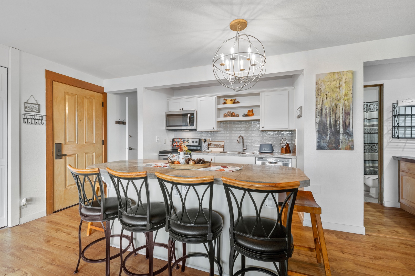 Sip morning coffee or grab a bite at the kitchen counter, with seating for 6