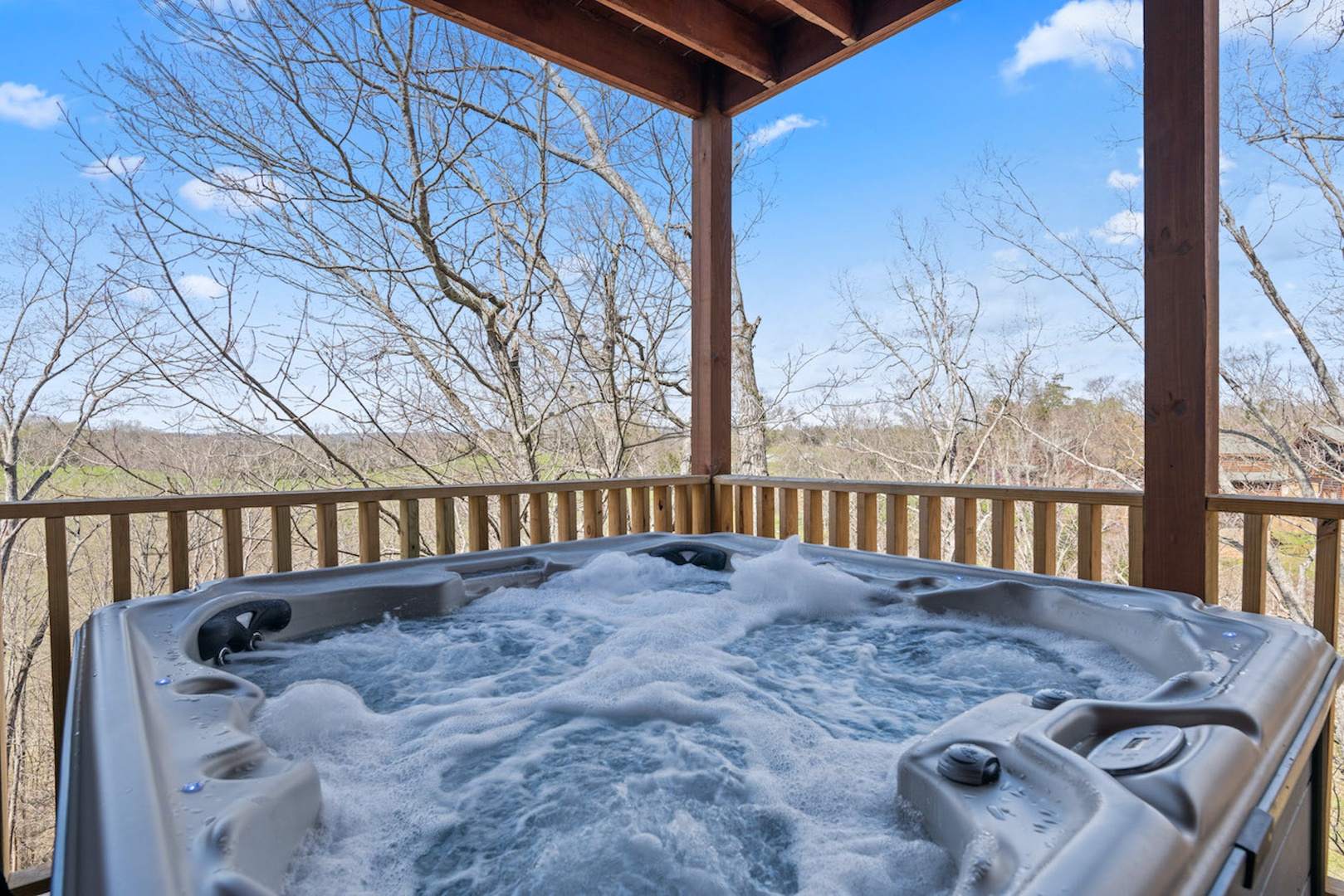 Soak the day away with treetop views in the private hot tub