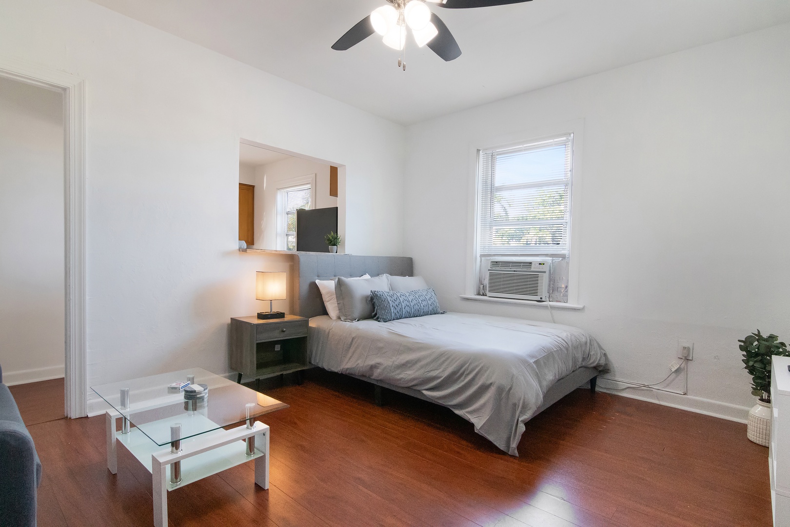 This cozy Living/Sleeping Area offers a Queen Bed and Smart TV with Window AC