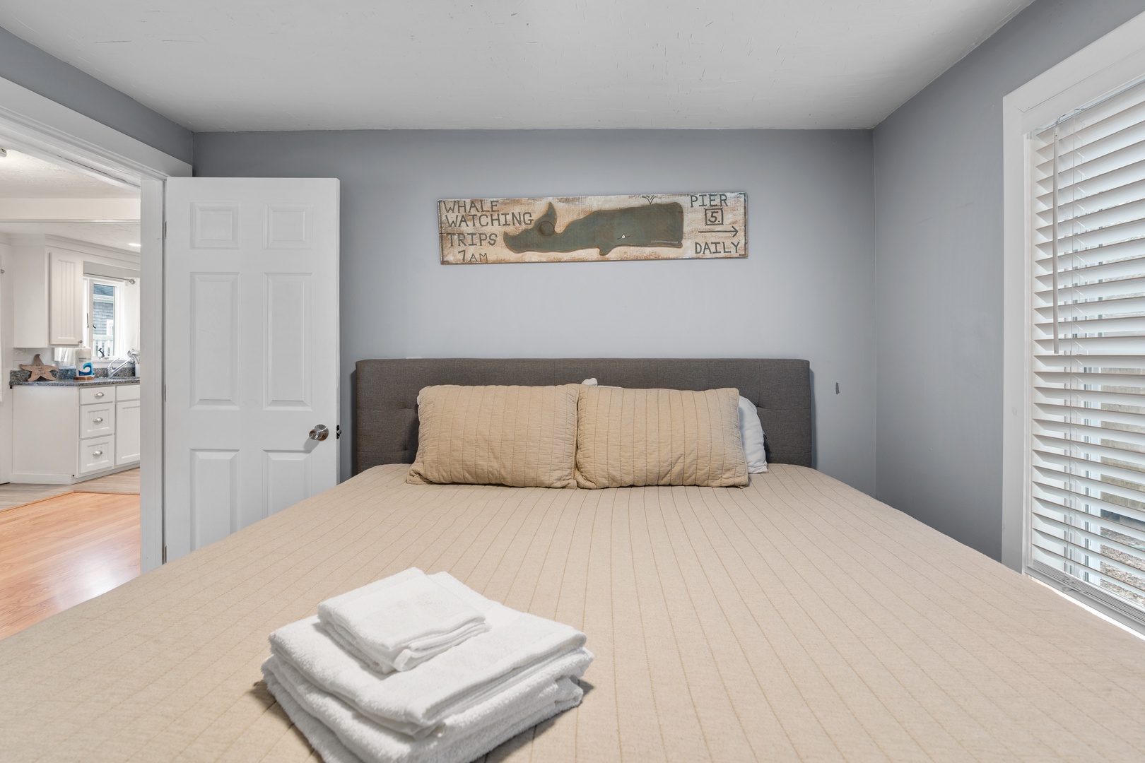 The first of two bedroom retreats features a plush king-sized bed & TV