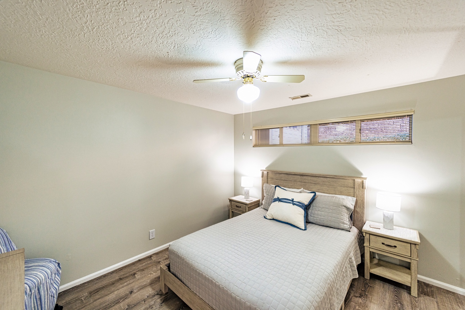 Relax in the peaceful second bedroom with a comfortable queen bed