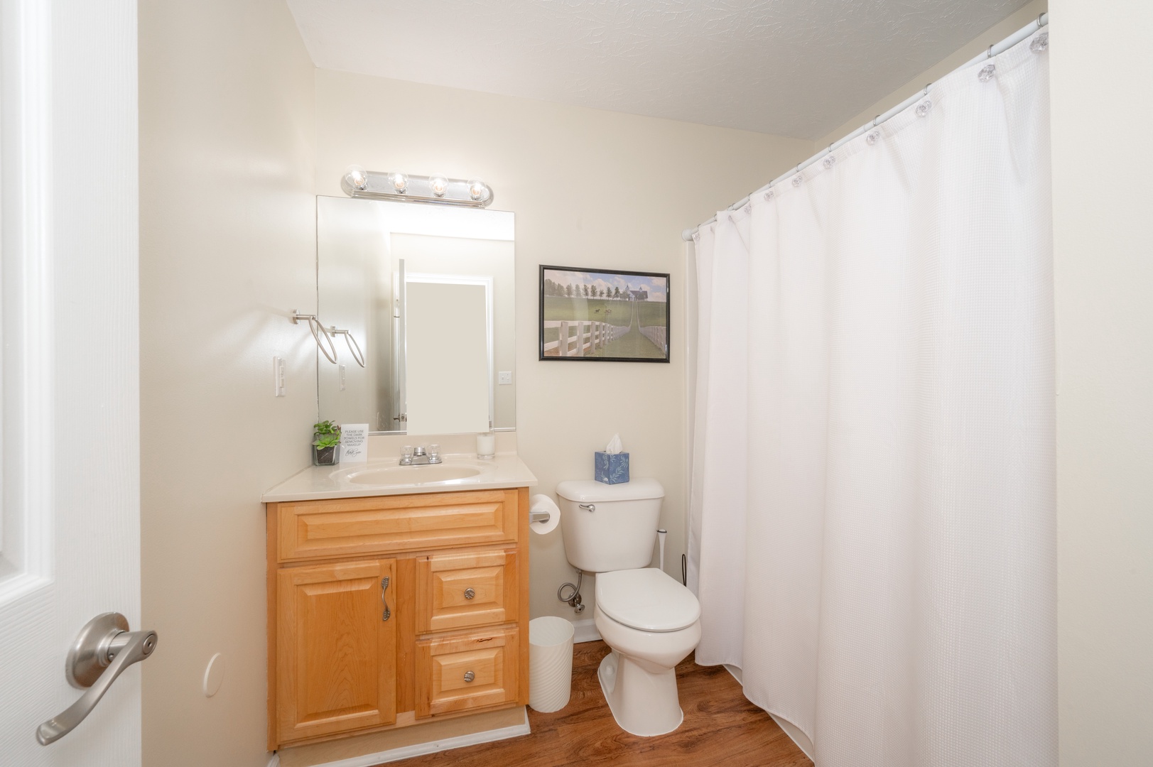 This upper-level full bath includes a single vanity & shower/tub combo