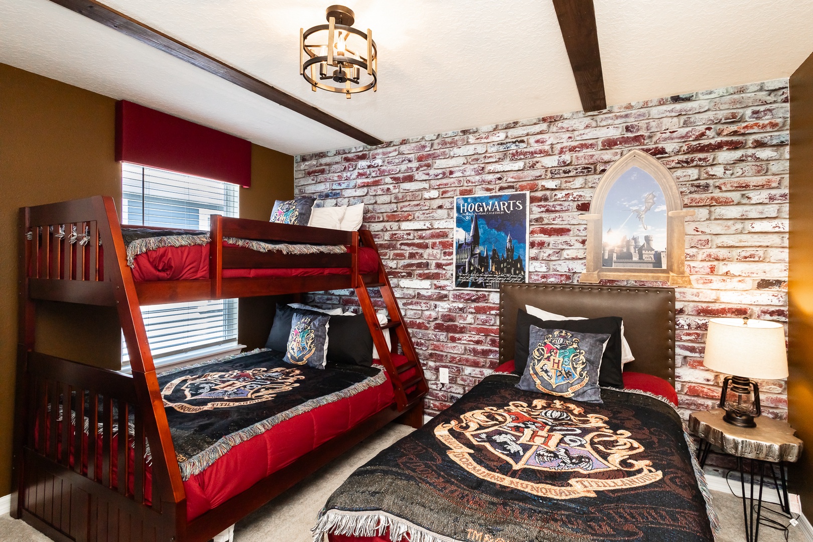 This 2nd floor bedroom offers twin-over-full bunks & a standalone twin bed