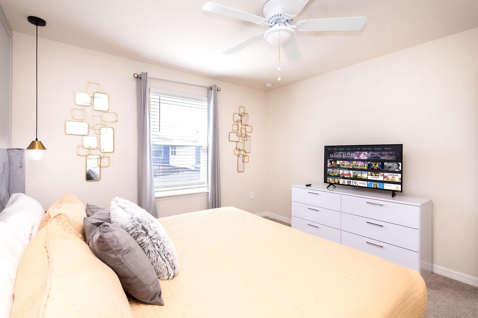 The final bedroom on the 2nd floor offers a king bed, ceiling fan, & Smart TV