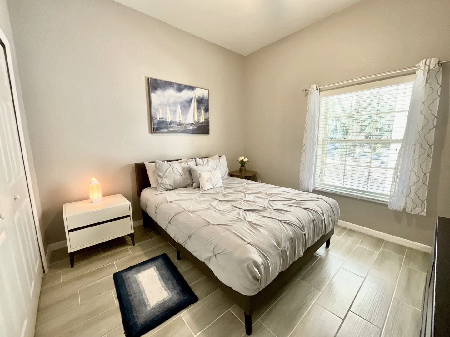 The final bedroom offers a cozy queen bed & Smart TV