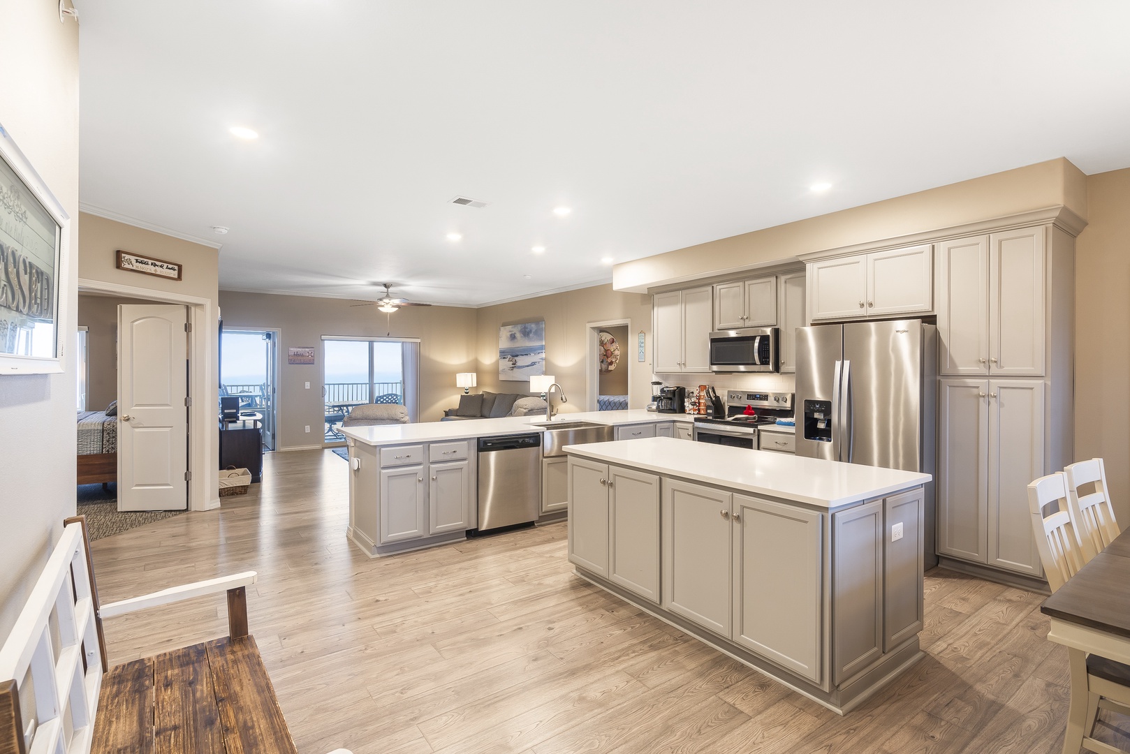 The airy kitchen is a chef's dream, with ample space & every home comfort