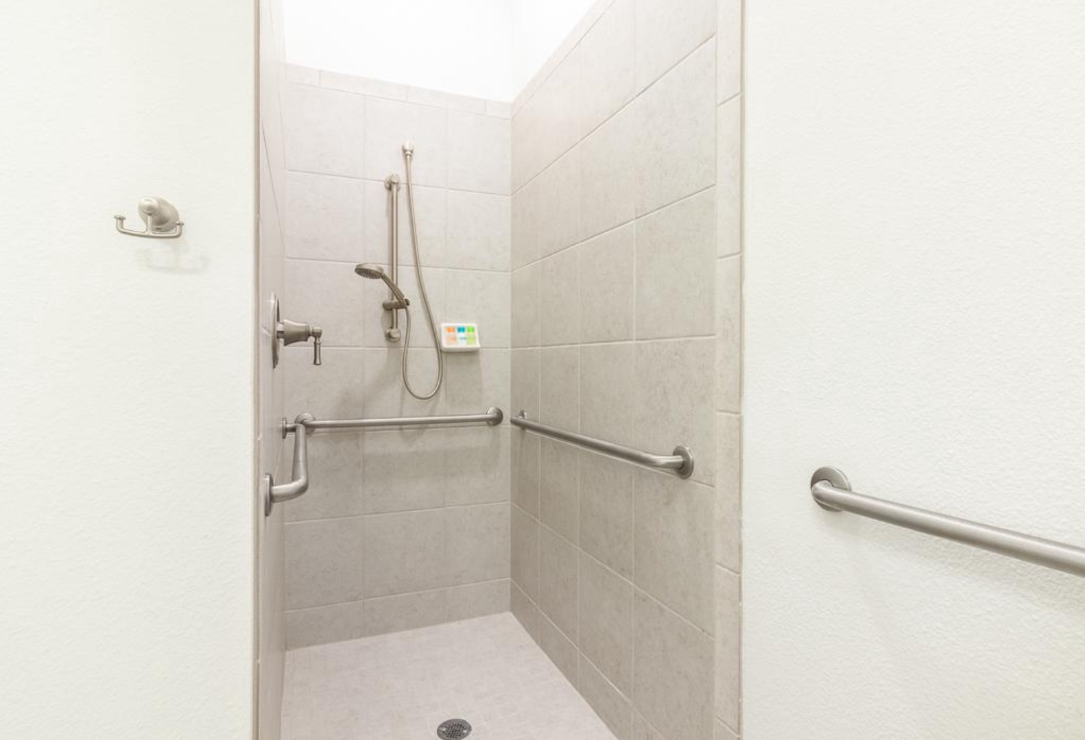 Wash up in this first floor handicap accessible ensuite, featuring a single vanity & roll-in shower