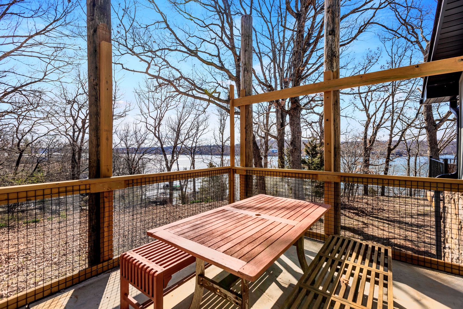 Enjoy a serene view of the lake from the patio off the bedroom