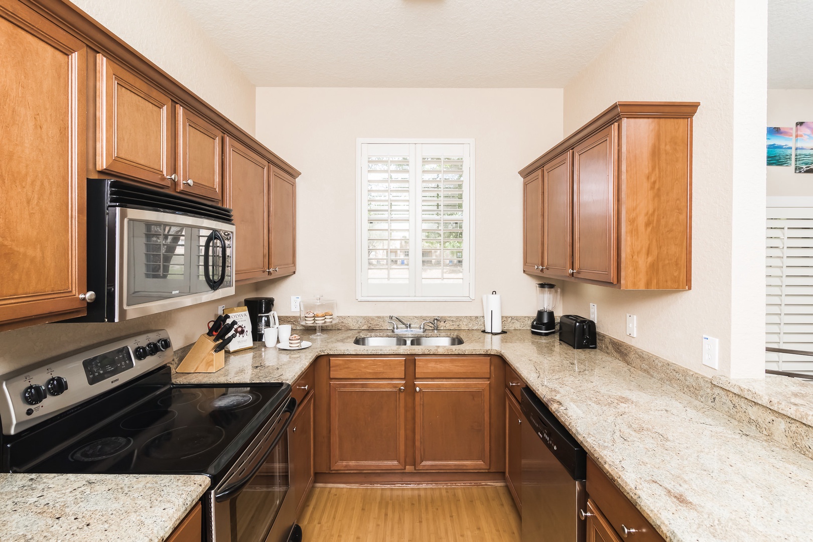 Kitchen equipped with stainless steel appliances and extra items