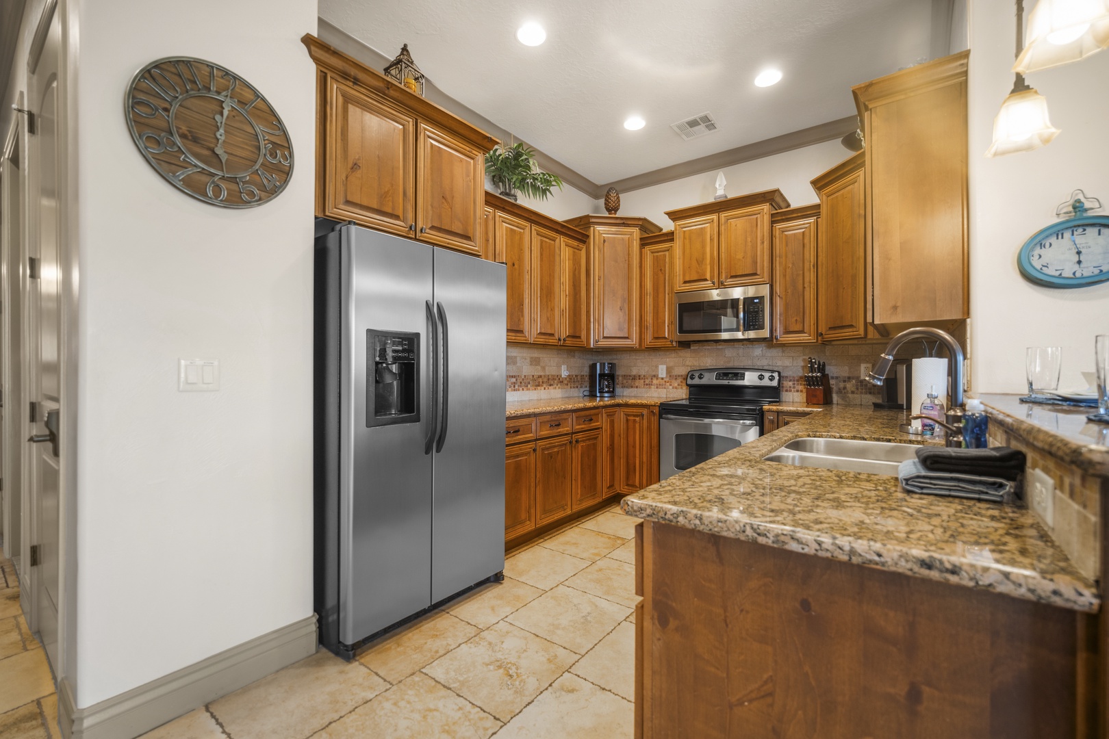 The warm, open kitchen offers ample space & every home comfort