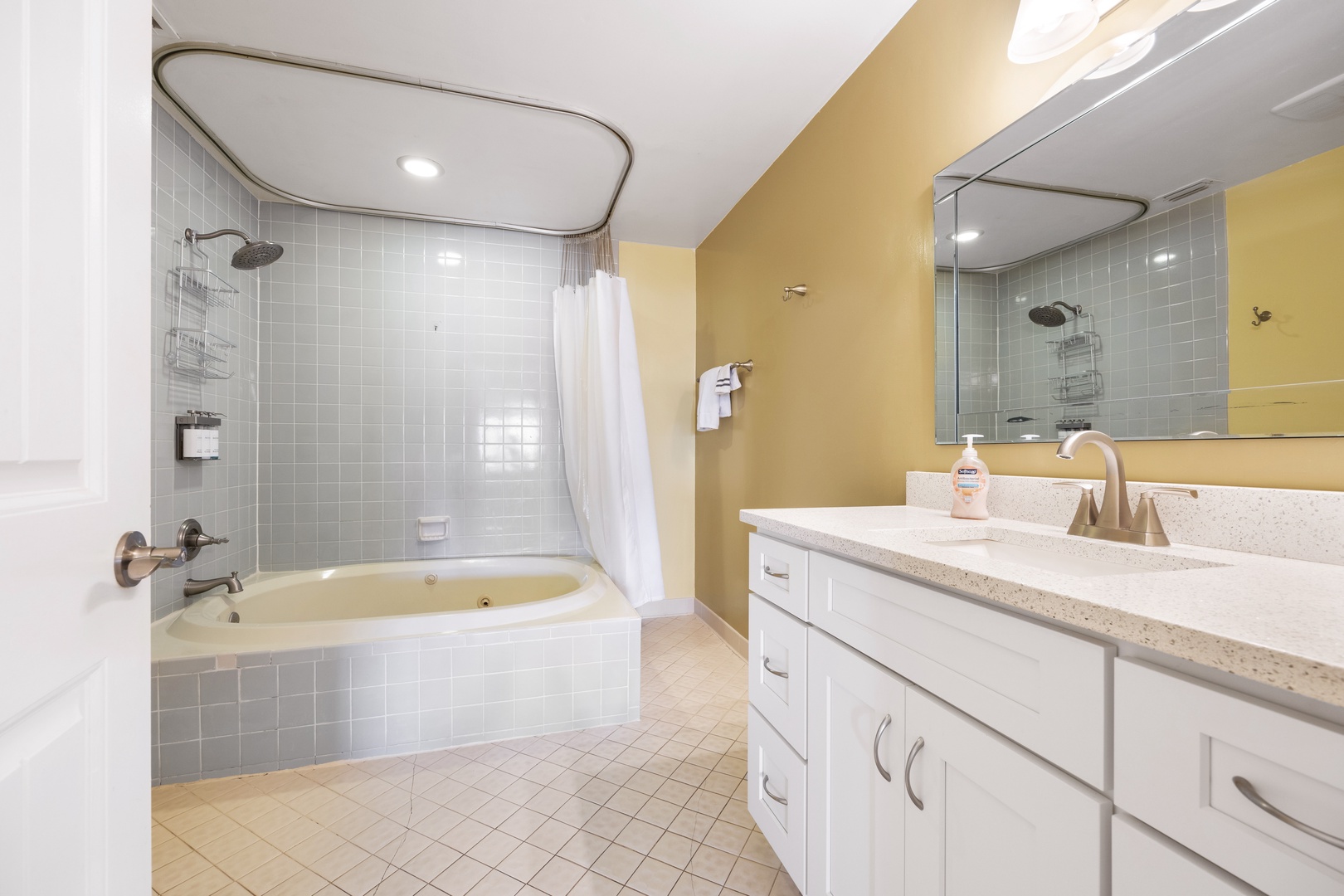 The master en suite offers a pair of large vanities & shower/jetted tub combo