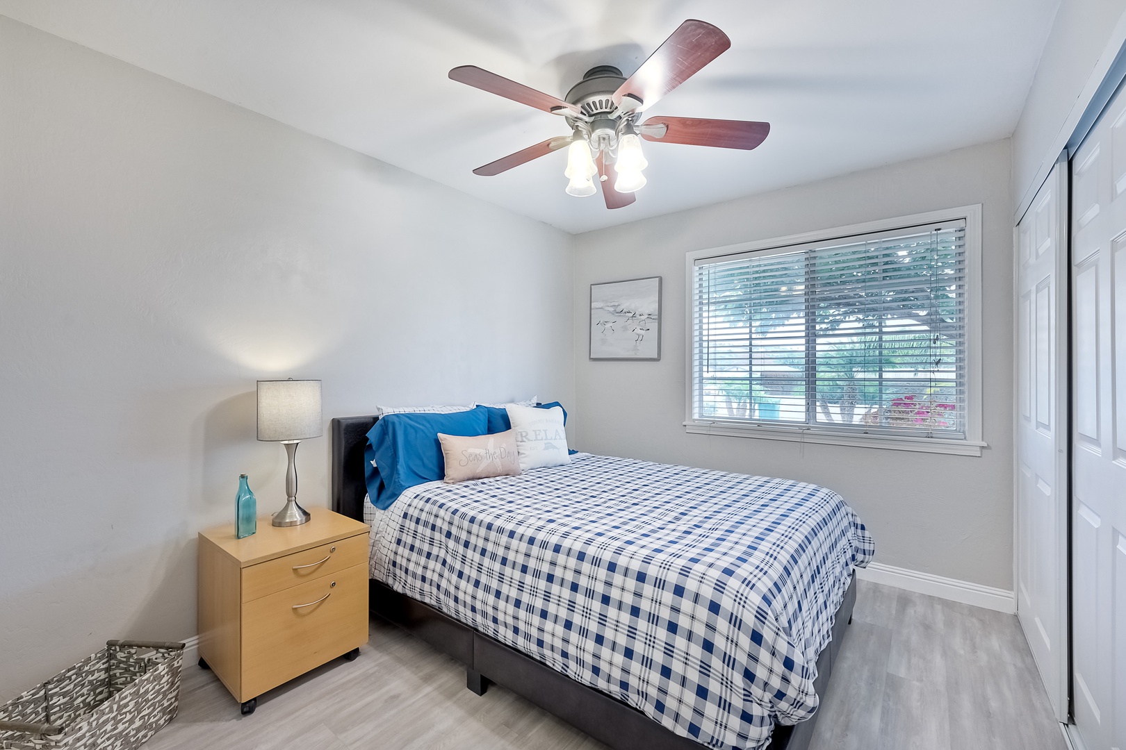 Relax in this tranquil bedroom complete with queen bed & closet