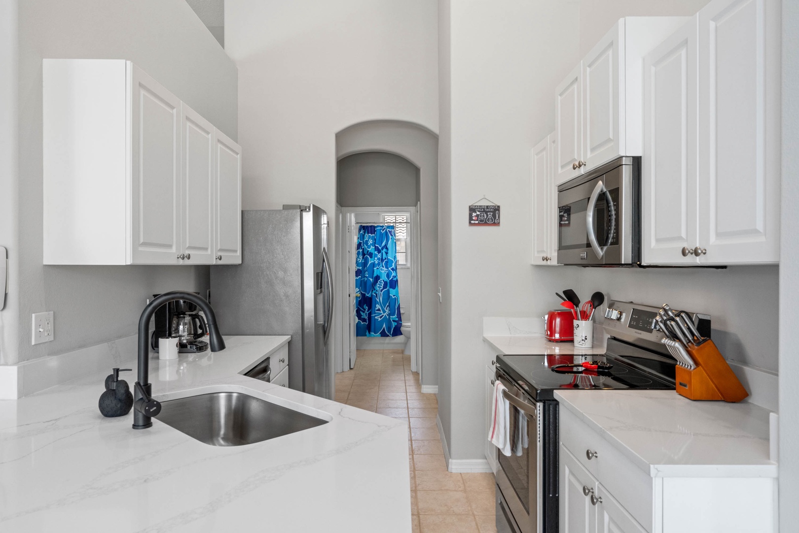The sleek kitchen offers fantastic amenities and plenty of counter space