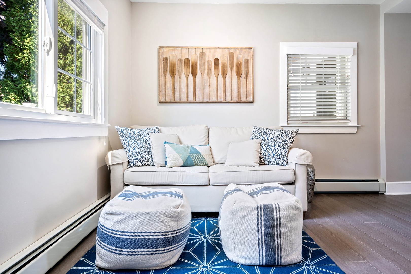 Relax in this cozy first-floor bonus living room with a sleeper sofa